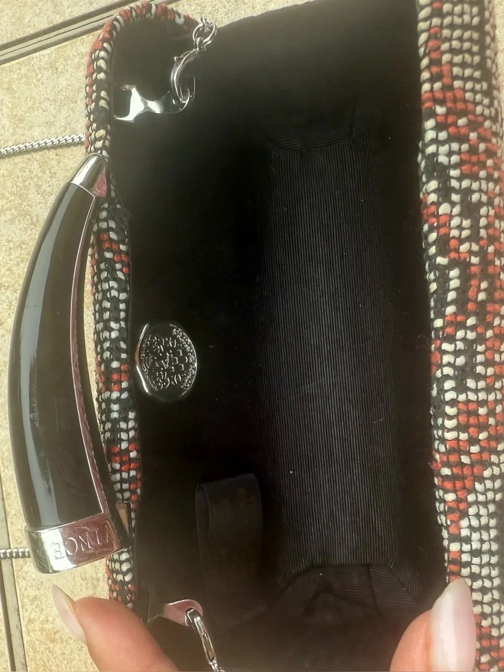 Vince Camuto textured clutch bag with a crossbody chain